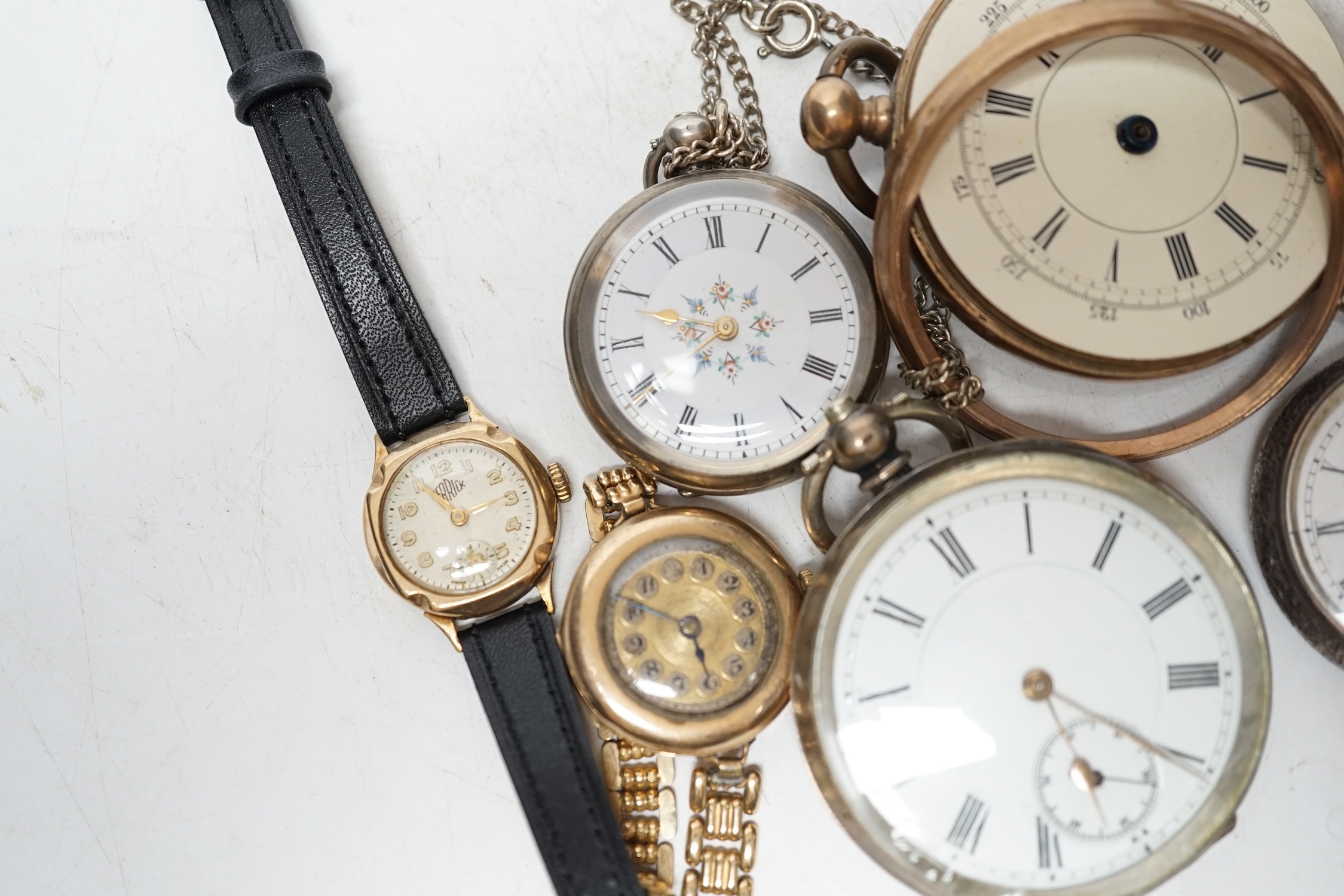 Two lady's 9ct gold manual wind wrist watches on gold plated straps, a gold plated wrist watch, two fob watches and two pocket watches. Condition - poor to fair